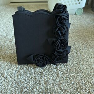 Elegant Black Clutch with Floral Accents